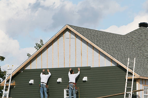 Professional Siding technician working in Gainesville, TX